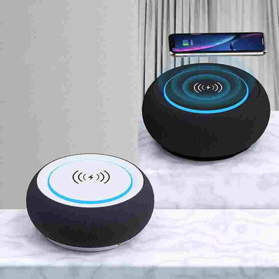 Wireless Bluetooth Speaker Loud Volume Subwoofer Dual Speakers with built-in wireless charging pad, shown in black and white color options.