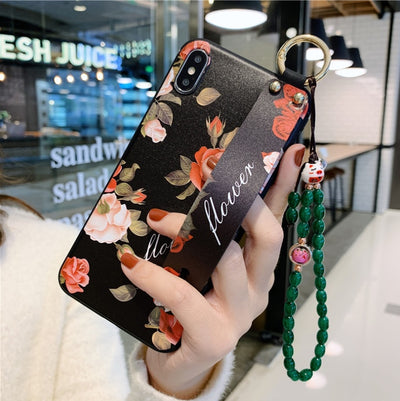 Rose flowers wrist strap phone case compatible with Apple iPhone models, stylish floral iPhone case with wrist strap, durable protective phone cover for iPhone, perfect accessory for Apple iPhone users